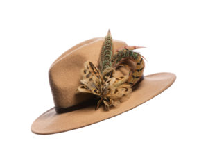 Blue hen pheasant biot feather hat pin pinned to a tan fedora on a white background.